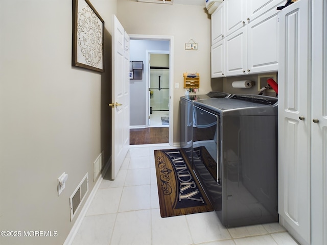 89 Pebble Beach Blvd, Jackson, NJ 08527 - laundry area featuring cabinet space, washer and dryer, light tile patterned floors, and baseboards