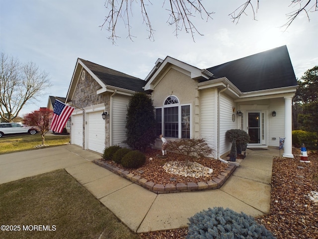 89 Pebble Beach Blvd, Jackson, NJ 08527 - view of home's exterior featuring concrete driveway, a garage, and stone siding