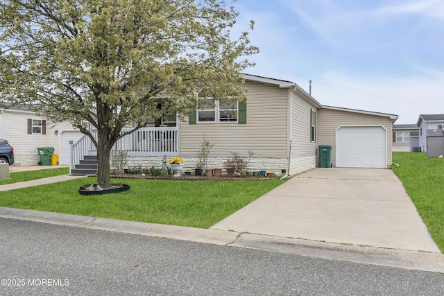 view of front of home with driveway, a front lawn, covered porch, and a garage