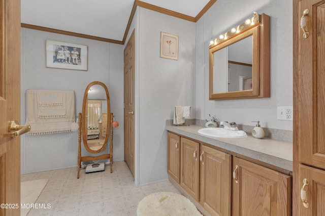 bathroom with tile patterned floors, vanity, and ornamental molding
