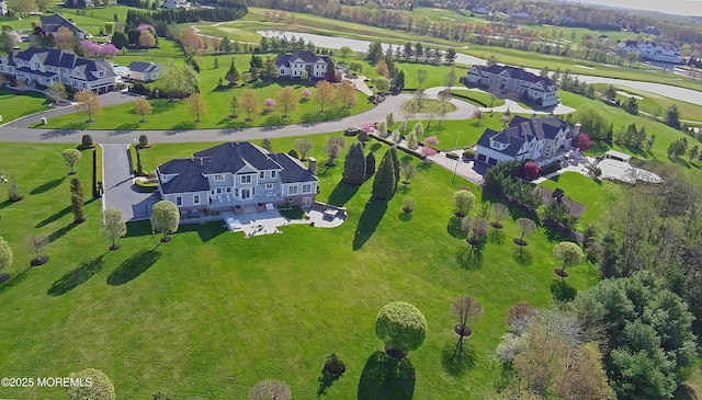 aerial view featuring a water view, golf course view, and a residential view