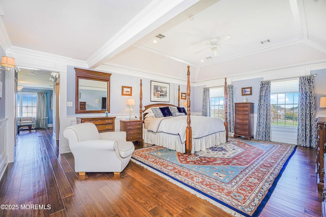 bedroom with crown molding, wood-type flooring, beam ceiling, and visible vents
