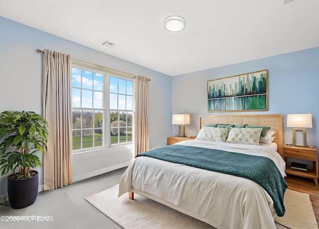 bedroom featuring visible vents, baseboards, and carpet floors