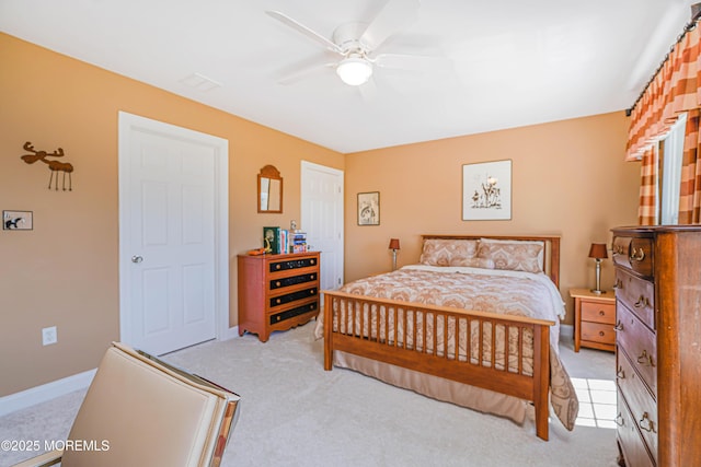 bedroom featuring baseboards, ceiling fan, and light carpet