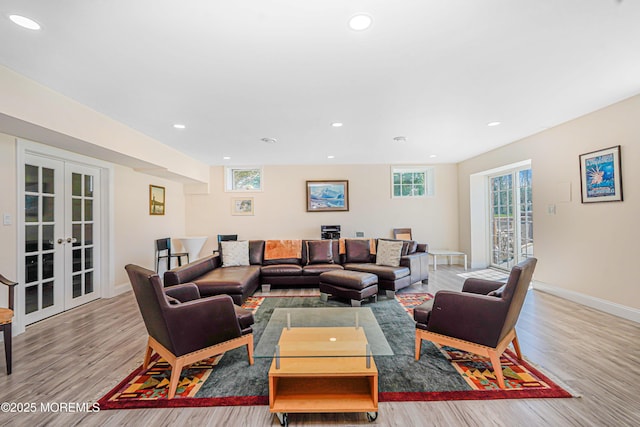 living room with recessed lighting, baseboards, french doors, and wood finished floors