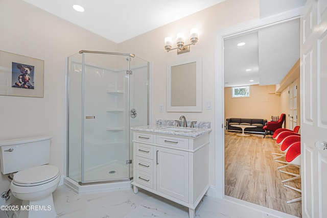 bathroom featuring a shower stall, vanity, toilet, marble finish floor, and recessed lighting