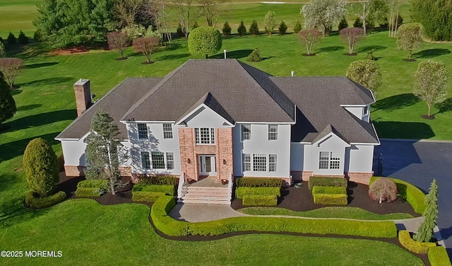 view of front of house featuring a chimney