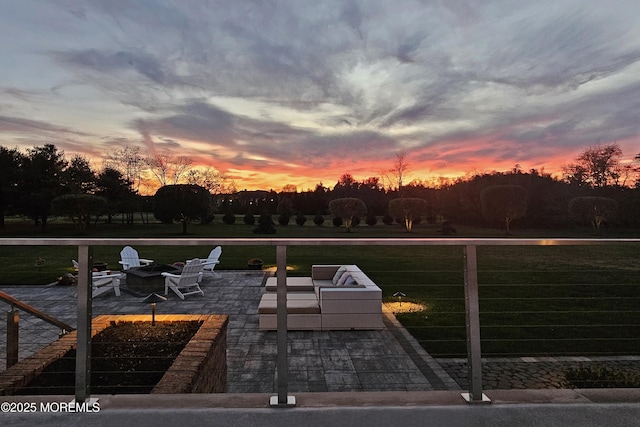 exterior space featuring an outdoor fire pit and a patio area
