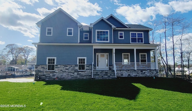 craftsman house with a porch and a front lawn