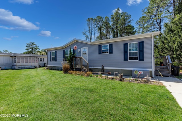 manufactured / mobile home with a front lawn