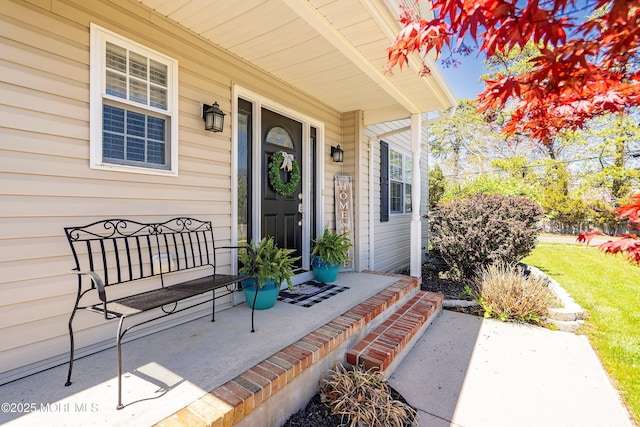 entrance to property featuring a porch