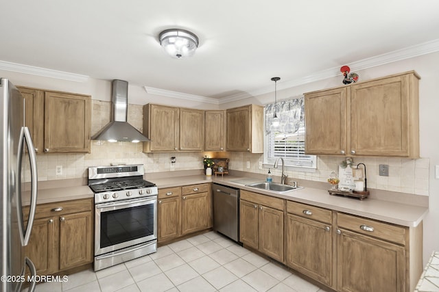 kitchen with wall chimney range hood, stainless steel appliances, a sink, and tasteful backsplash