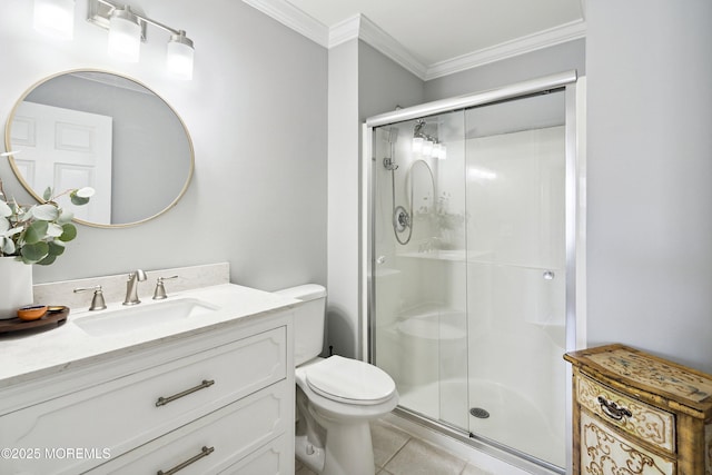 full bathroom featuring crown molding, tile patterned flooring, a stall shower, vanity, and toilet