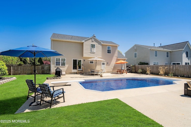 view of pool featuring a fenced backyard, a fenced in pool, a patio area, entry steps, and a lawn