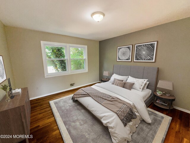 11 Green Hills Rd, East Brunswick, NJ 08816 - bedroom with baseboards and wood finished floors