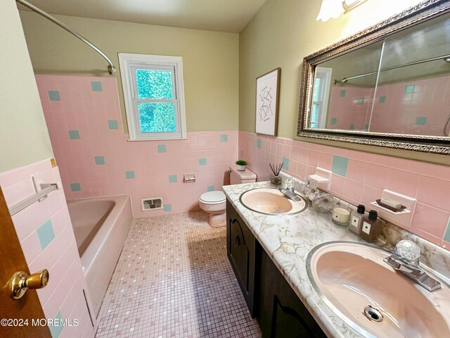 11 Green Hills Rd, East Brunswick, NJ 08816 - full bath with tile walls, tile patterned floors, toilet, and a sink