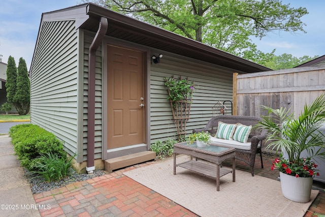 view of outbuilding with fence