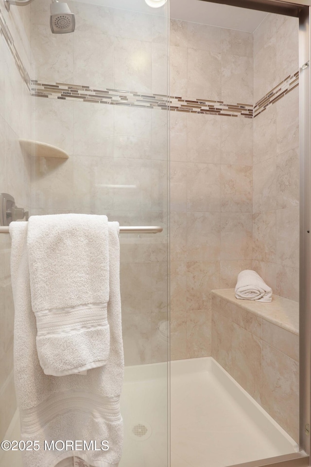 bathroom with a shower stall