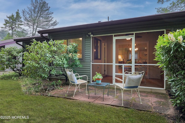 back of property featuring a yard