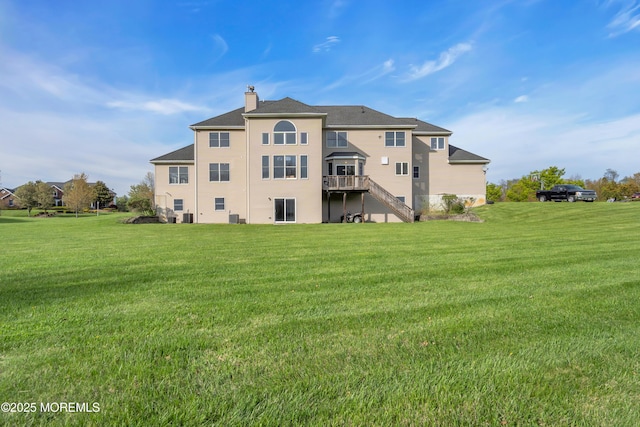 3 Scenic Way, Monroe, NJ 08831 - back of property with a chimney, a deck, stairs, and a lawn