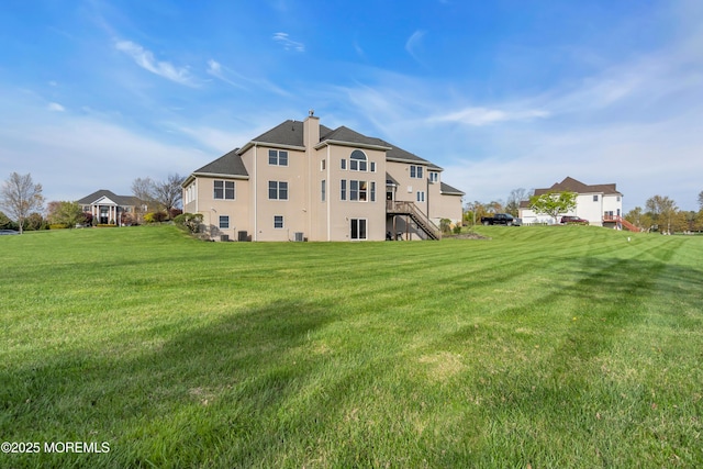 3 Scenic Way, Monroe, NJ 08831 - rear view of house with a yard and a chimney