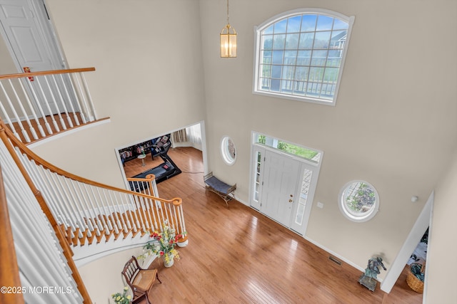 3 Scenic Way, Monroe, NJ 08831 - foyer featuring stairway, wood finished floors, a towering ceiling, and visible vents