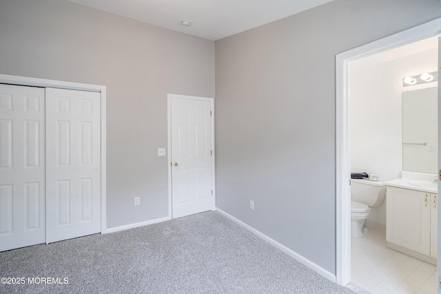 2304 Wendover Dr, Pompton Plains, NJ 07444 - unfurnished bedroom featuring a sink, ensuite bathroom, a closet, light colored carpet, and baseboards