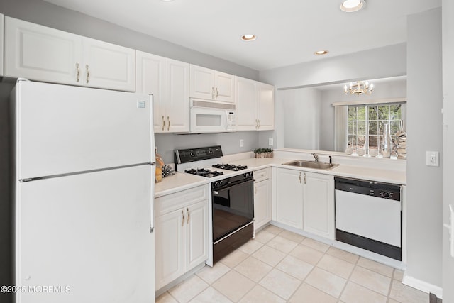 2304 Wendover Dr, Pompton Plains, NJ 07444 - kitchen featuring light countertops, white cabinetry, white appliances, light tile patterned flooring, and a notable chandelier