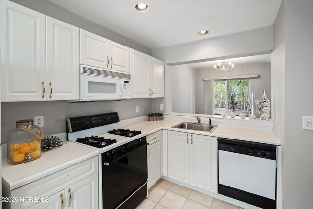 2304 Wendover Dr, Pompton Plains, NJ 07444 - kitchen featuring white cabinets, a chandelier, a sink, and white appliances
