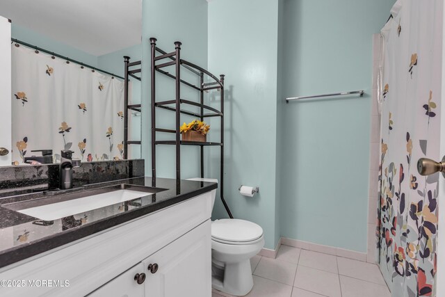 30 Frost Ln, East Windsor, NJ 08520 - bathroom featuring tile patterned flooring, vanity, toilet, baseboards, and curtained shower