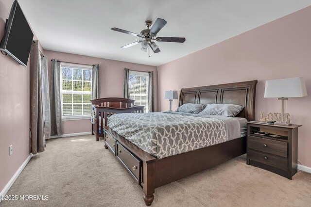 30 Frost Ln, East Windsor, NJ 08520 - bedroom with baseboards, light colored carpet, and ceiling fan