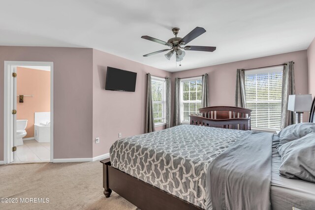 30 Frost Ln, East Windsor, NJ 08520 - carpeted bedroom featuring baseboards, ceiling fan, and ensuite bath