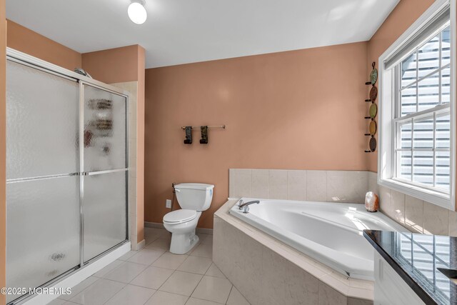 30 Frost Ln, East Windsor, NJ 08520 - full bath featuring tile patterned flooring, toilet, a wealth of natural light, a bath, and a stall shower