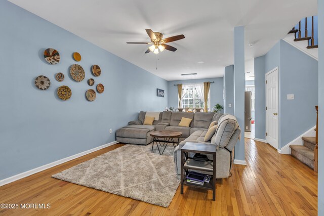 30 Frost Ln, East Windsor, NJ 08520 - living room featuring a ceiling fan, hardwood / wood-style flooring, baseboards, and stairway