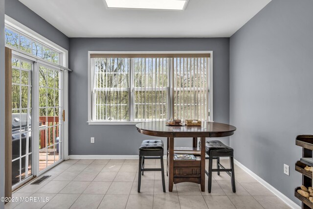 30 Frost Ln, East Windsor, NJ 08520 - dining space featuring baseboards, light tile patterned flooring, and visible vents