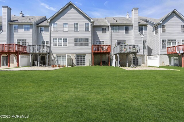 30 Frost Ln, East Windsor, NJ 08520 - rear view of house featuring a lawn, a wooden deck, and a chimney