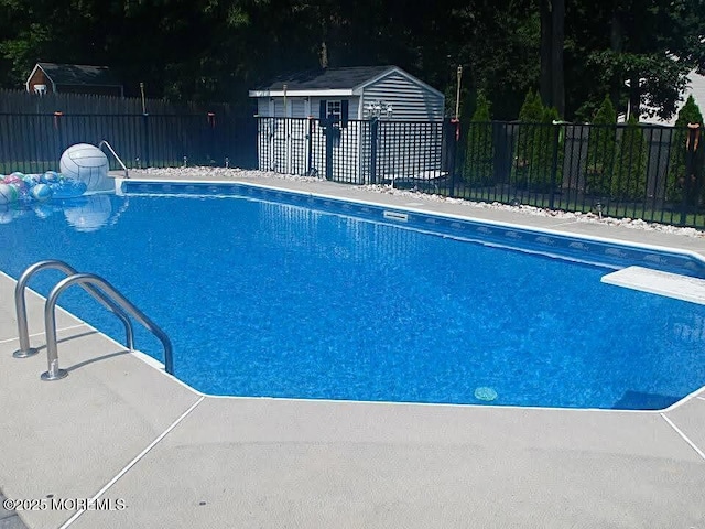 view of swimming pool with a fenced in pool and fence