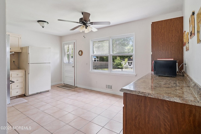 5 Pennsylvania Ave, Jackson, NJ 08527 - kitchen featuring freestanding refrigerator, a ceiling fan, and light tile patterned floors