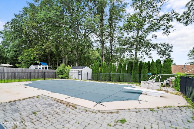 5 Pennsylvania Ave, Jackson, NJ 08527 - view of pool featuring a patio area, a storage unit, and a diving board