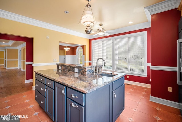159 Sprague Ave, West Creek, NJ 08092 - kitchen featuring crown molding, a sink, baseboards, a notable chandelier, and an island with sink