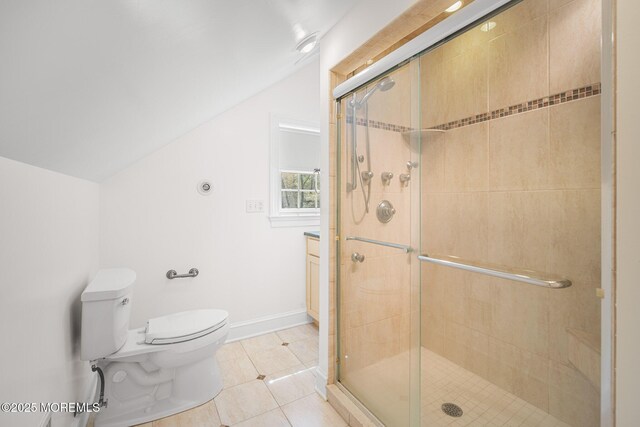 159 Sprague Ave, West Creek, NJ 08092 - bathroom featuring tile patterned floors, vaulted ceiling, toilet, and a shower stall