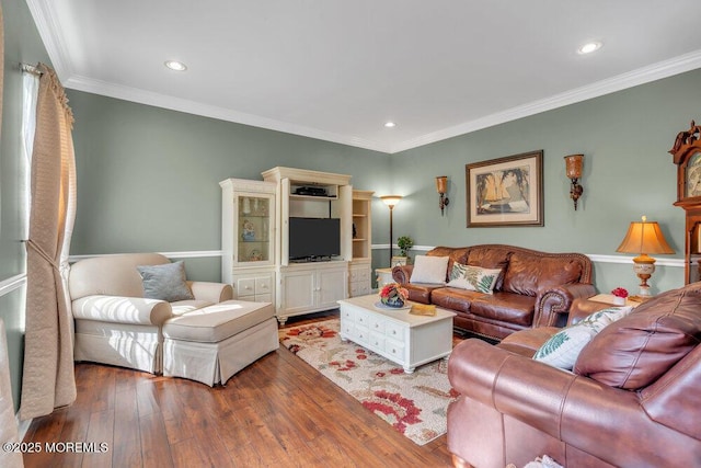 living area with ornamental molding, recessed lighting, and wood finished floors