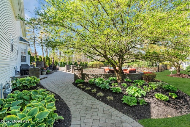 view of property's community with a patio area