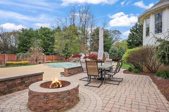 191 Robertsville Rd, Freehold, NJ 07728 - view of patio / terrace featuring a fenced backyard, a fenced in pool, a fire pit, and outdoor dining space