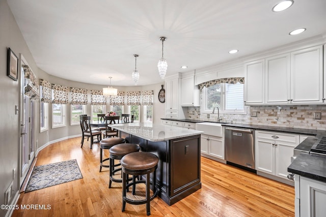 191 Robertsville Rd, Freehold, NJ 07728 - kitchen with stainless steel dishwasher, a center island, a sink, and a wealth of natural light