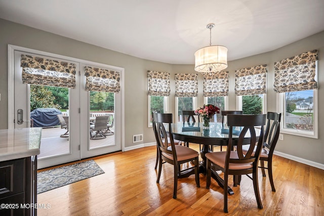 191 Robertsville Rd, Freehold, NJ 07728 - dining room featuring visible vents, light wood finished floors, baseboards, and a notable chandelier