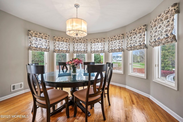191 Robertsville Rd, Freehold, NJ 07728 - dining area featuring baseboards, a healthy amount of sunlight, a chandelier, and visible vents
