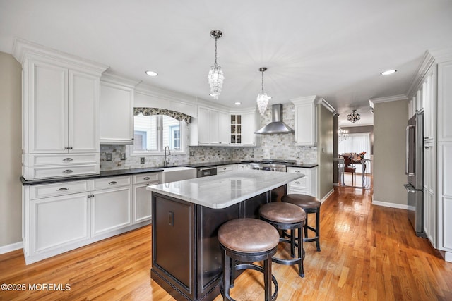 191 Robertsville Rd, Freehold, NJ 07728 - kitchen featuring white cabinets, light wood-style flooring, a sink, tasteful backsplash, and wall chimney range hood