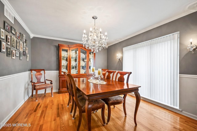 191 Robertsville Rd, Freehold, NJ 07728 - dining space with a chandelier, light wood-style floors, visible vents, and crown molding