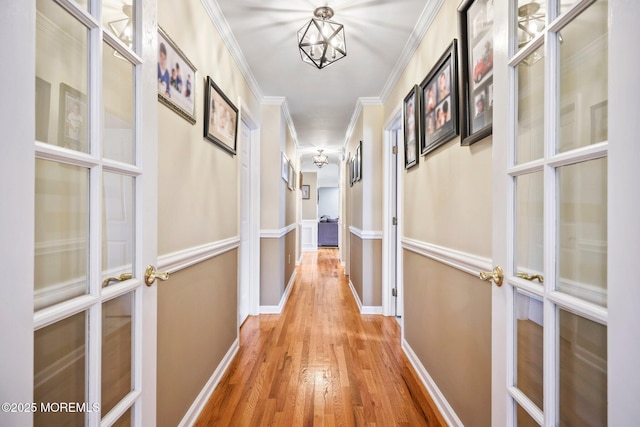 191 Robertsville Rd, Freehold, NJ 07728 - corridor featuring baseboards, french doors, wood finished floors, and crown molding